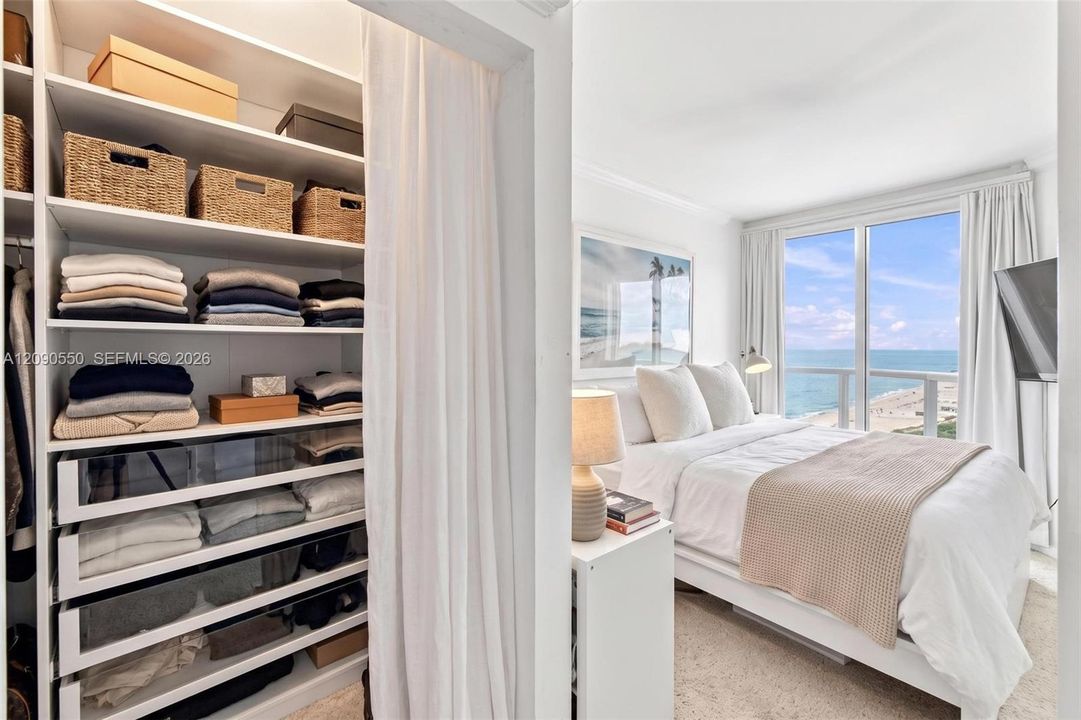 Secondary bedroom with private balcony. Photo Virtually Staged.
