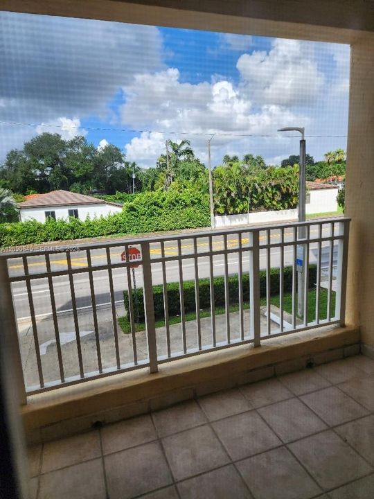 View of Sunset & pretty Coral Gables residential neighborhood