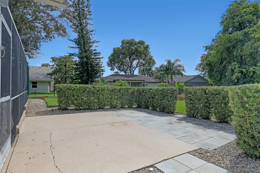 Concrete Pad outside of caged pool area