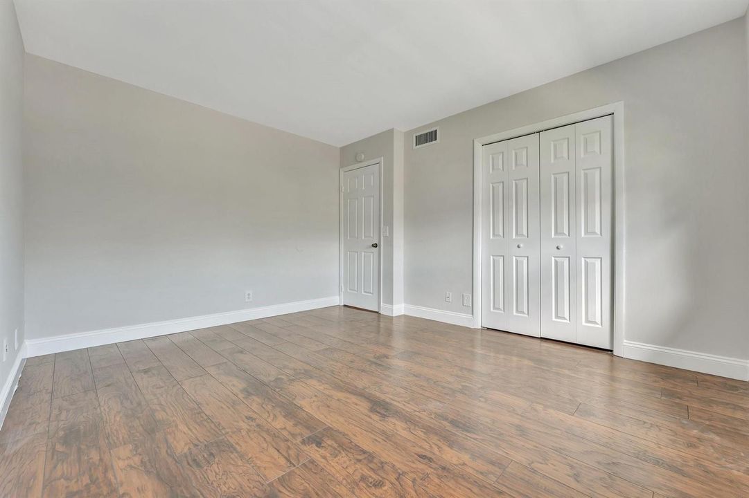 2nd spacious bedroom, shown vacant.