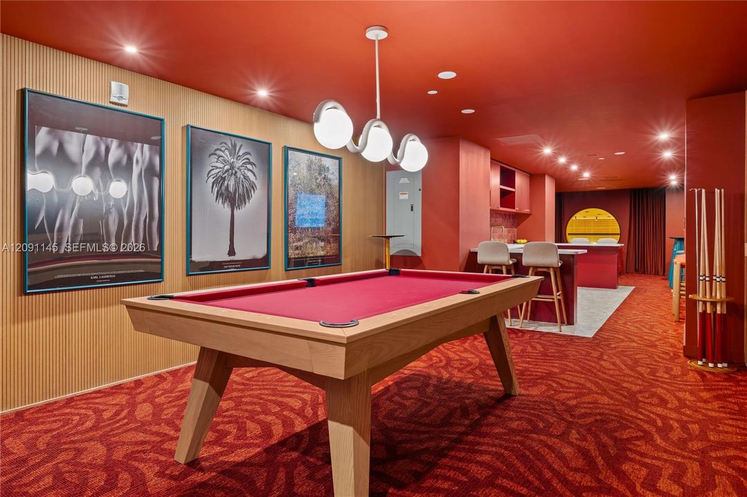 Recreation room featuring a pool table, built-in cabinetry, recessed lighting, and a linear pendant light fixture