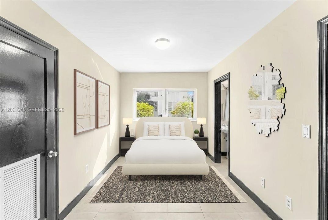 second bedroom with en suite bath and large laundry room