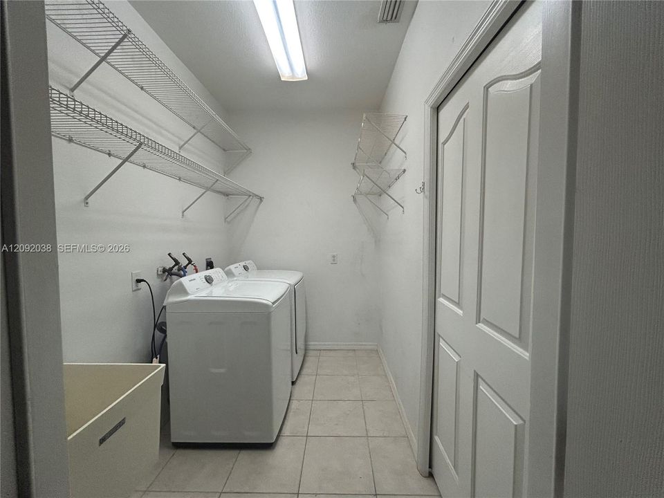Laundry room with plenty of storage space!