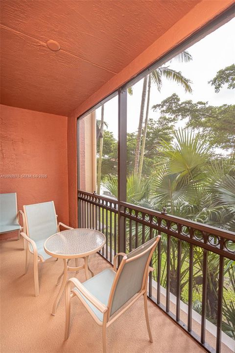 Screened balcony with textured orange walls and ceiling