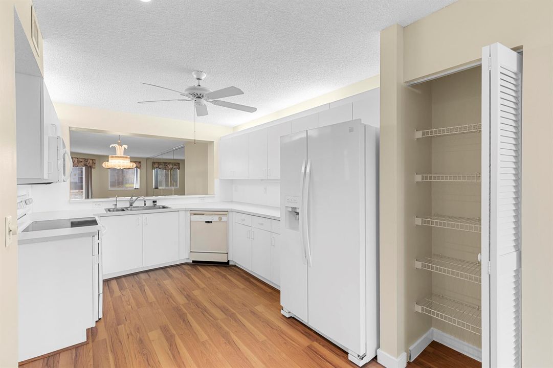 Kitchen with pass thru to Living Room