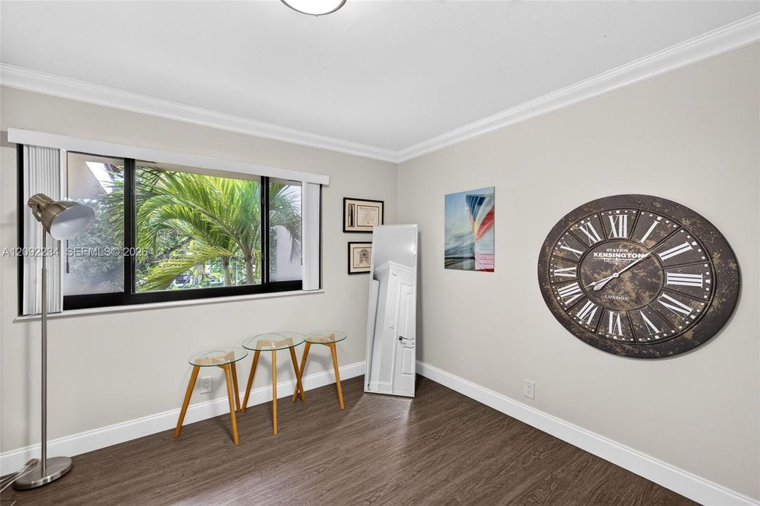 Impact Glass in the Third Bedroom Brightens the Room  with Filtered Light
