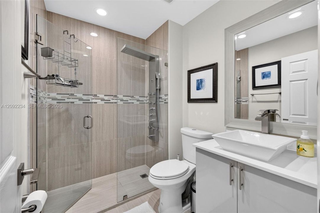 Third Floor Guest Bathroom Has a Sophisticated Heavy Frameless Glass Shower Entry