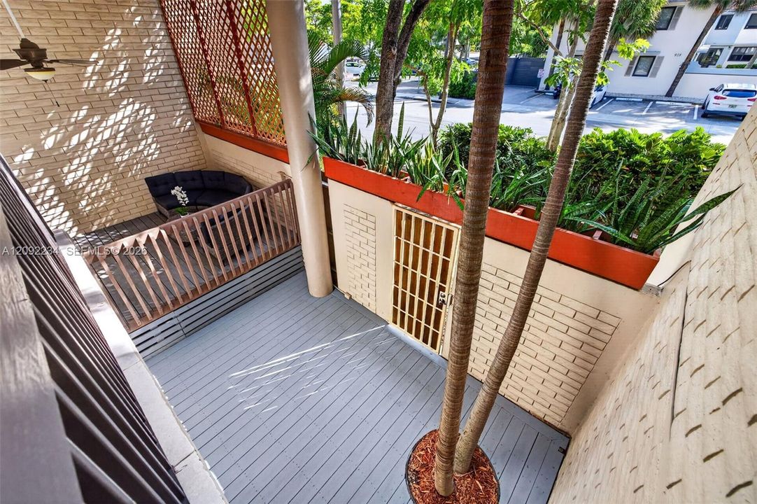 Second Floor Balcony Overlooks the Patio and Deck.