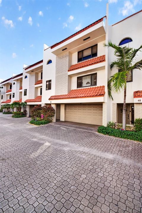 Traditional Terra Cota Barrel Tile Accents Gives the Complex a Classic Florida Look