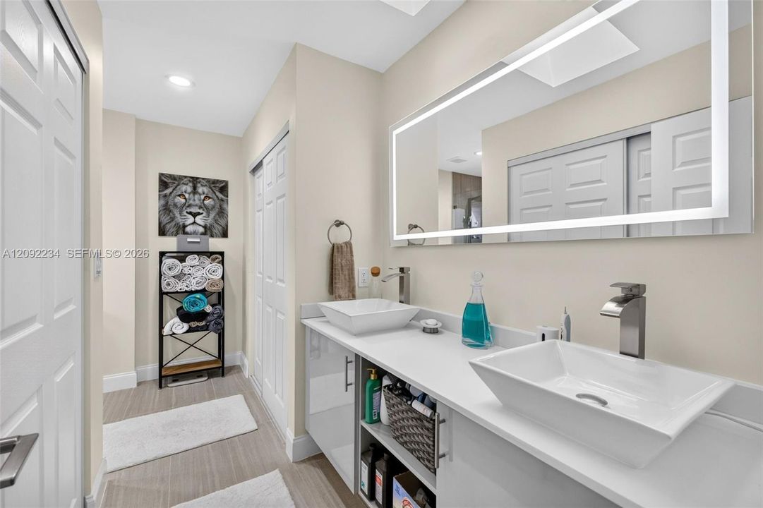 Top of the Line Dual Sinks and Lighted Mirror in the Master Bathroom