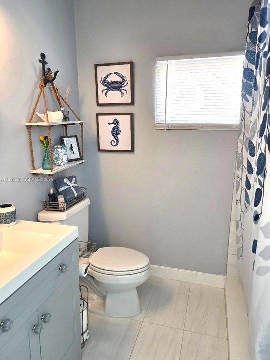 GUEST BATHROOM  WITH HIGH CEILINGS