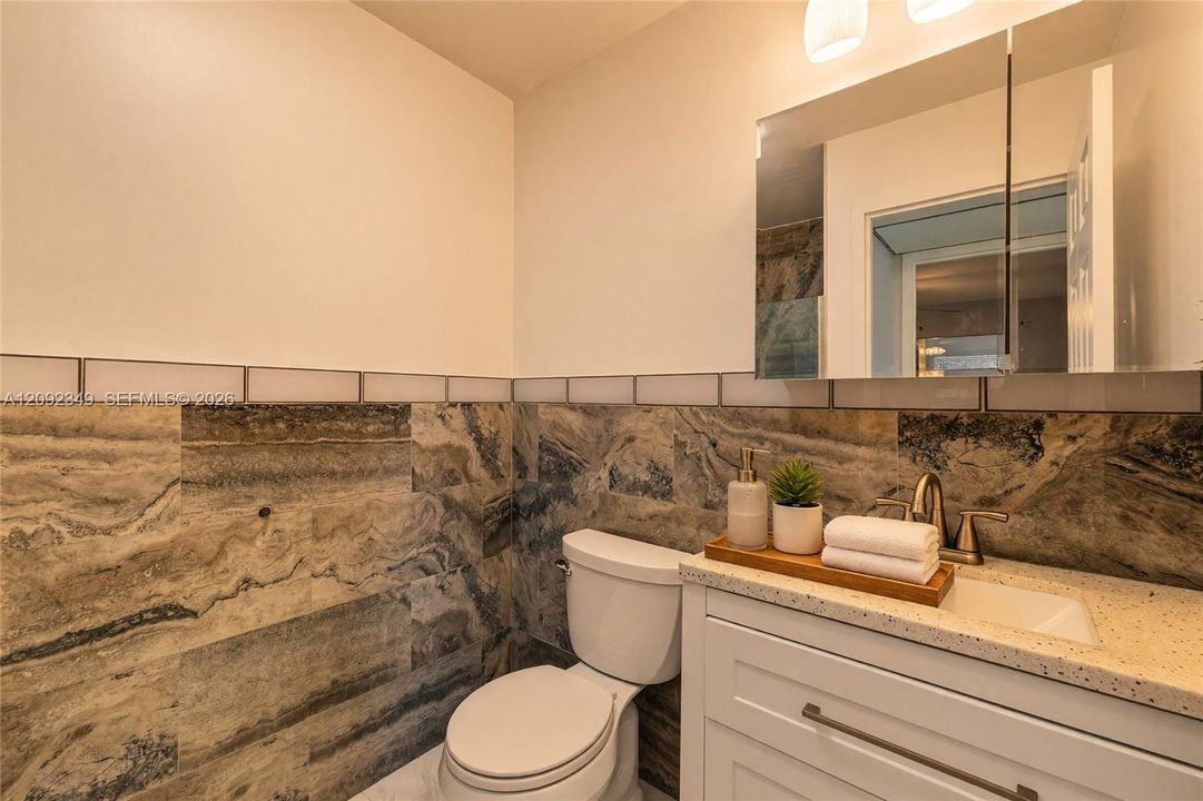 Virtual Staging: Master bathroom offers a large shower and marble back splash