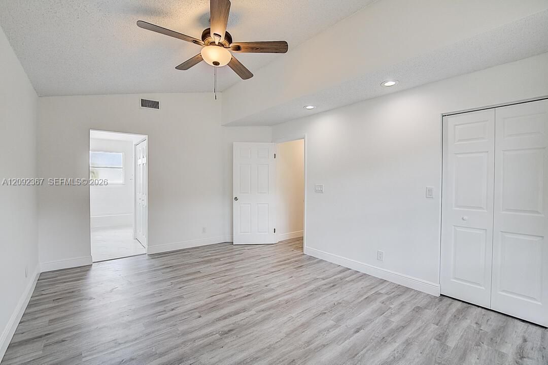 Primary Bedroom on first floor with primary bath and 2 walk in closets.
