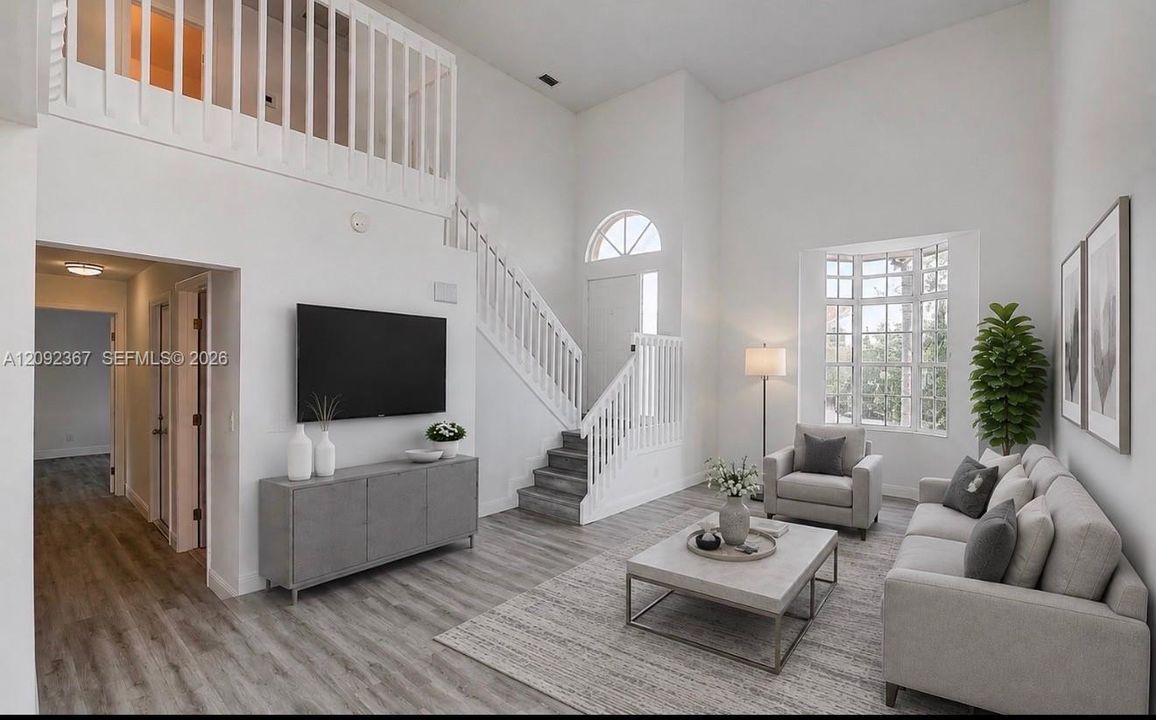 VIRTUAL STAGED - Step down to  living area with Beautiful Bay window.