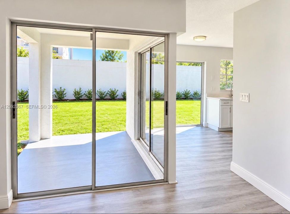 VIRTUAL STAGED back yard from Sliding Glass Doors 1 from Dining Area and 2 from Kitchen.