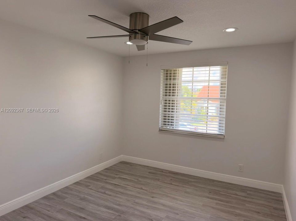 Upstairs Front Bedroom with window.