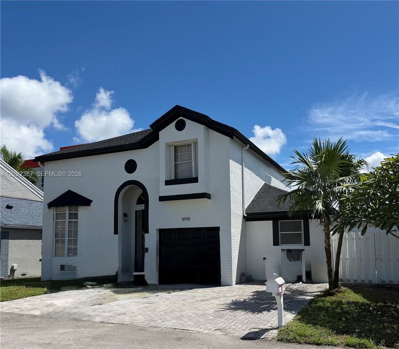 Front of Property with 1 car garage.