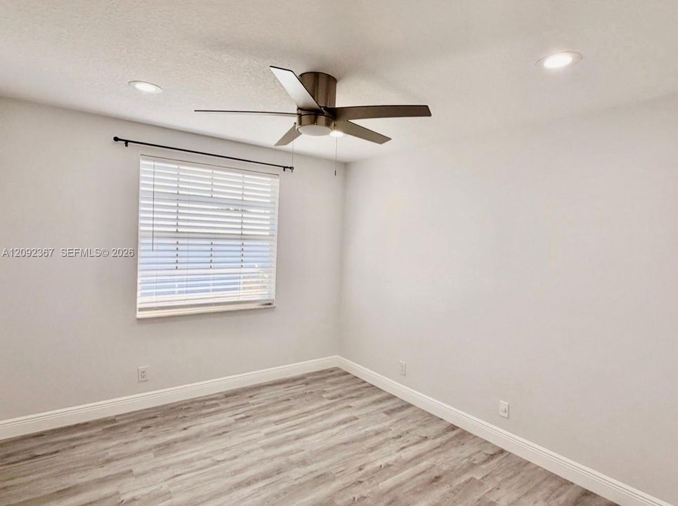 Upstairs 2nd Back Bedroom with window.
