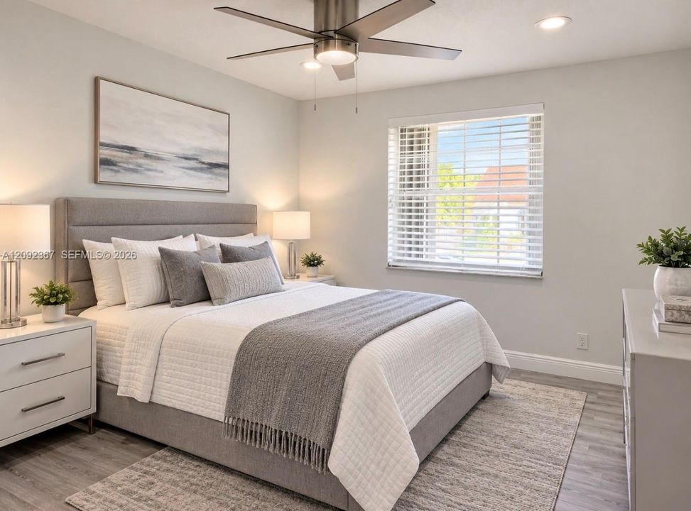 VIRTUAL STAGED - Upstairs Front Bedroom with window.
