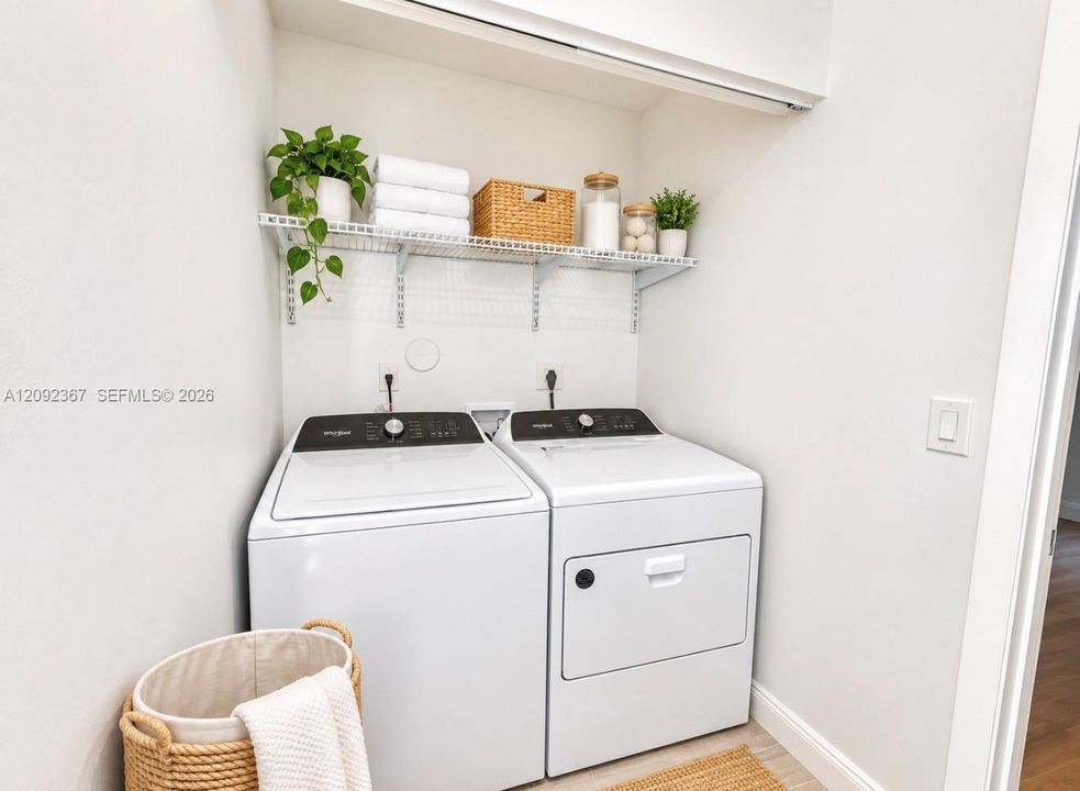 VIRTUAL STAGED - Laundry on first floor.
