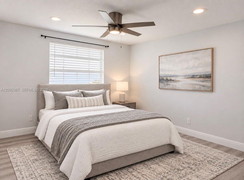 VIRTUAL STAGED - Upstairs 2nd Back Bedroom with window.