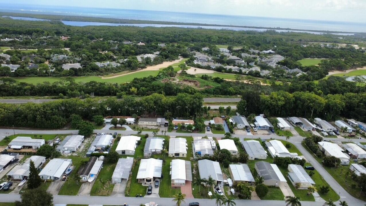 aerial of home and ocean