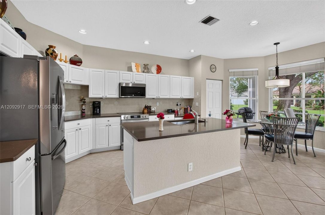 Updated kitchen with stainless appliances and quartz countertops.