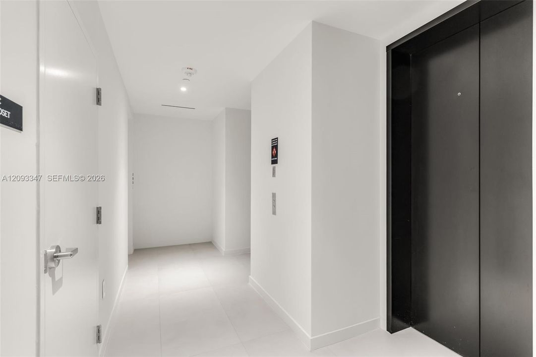 Entry hall opening directly into the living area with Biscayne Bay views