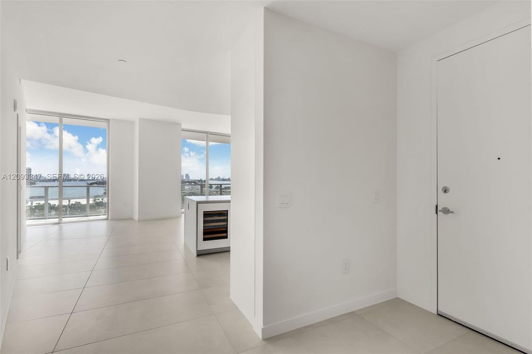 Primary bedroom with en suite bath and floor to ceiling windows