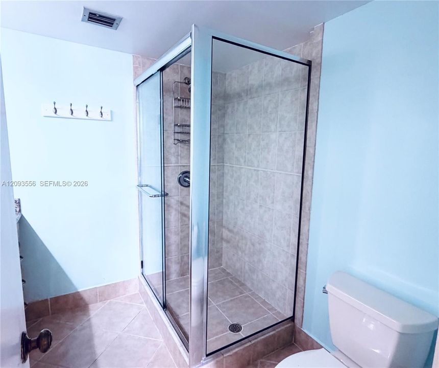Glass-enclosed stand-up shower