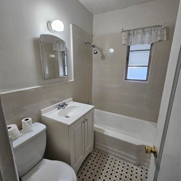 New vanity, sink, faucet and tub surround