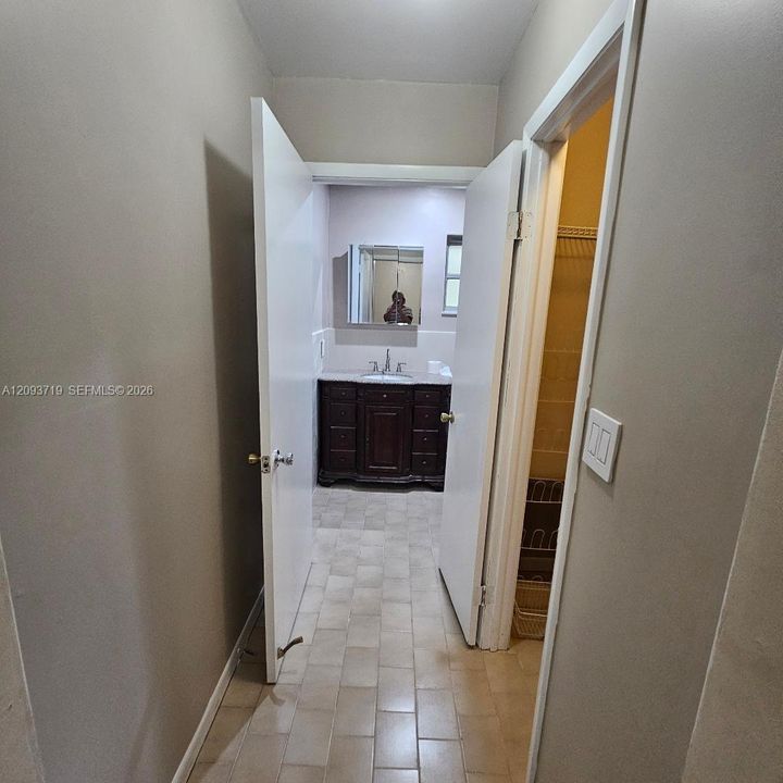 hallway to primary bath
