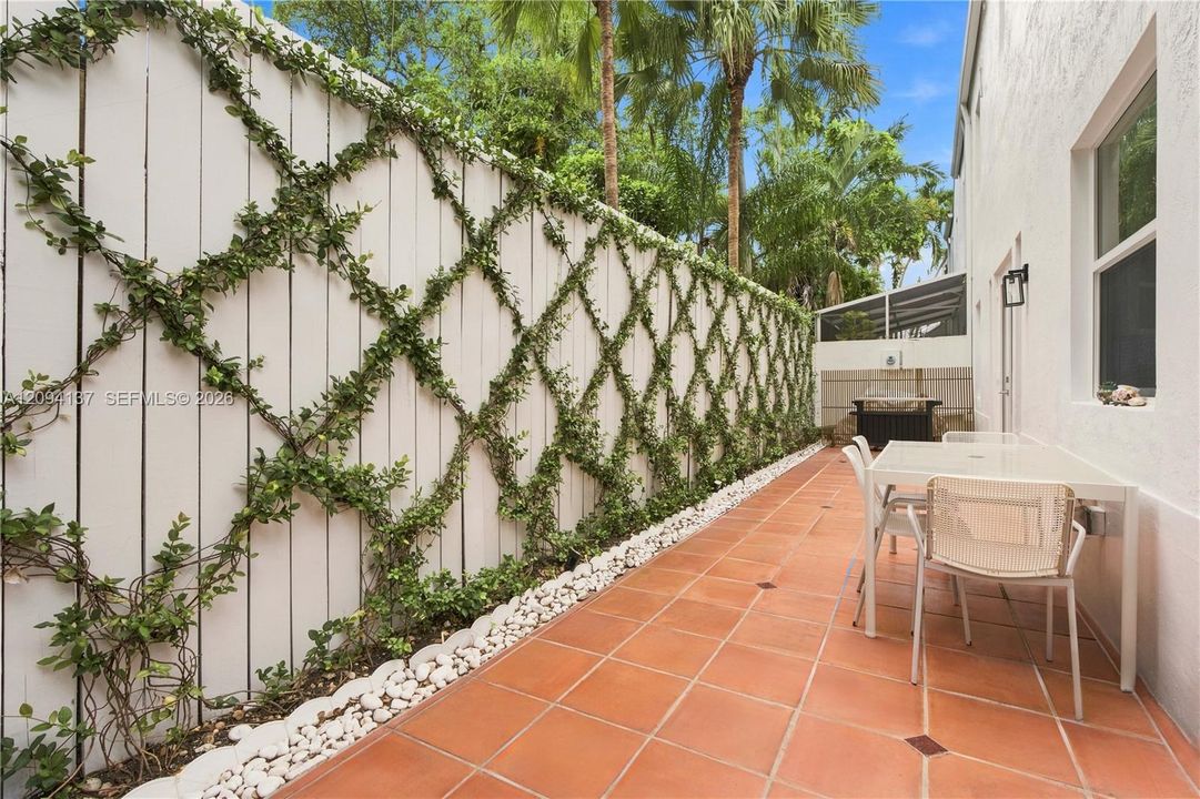 Exterior side patio with deck