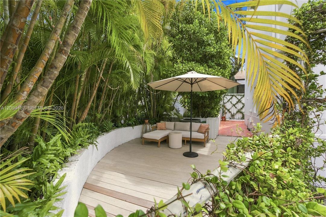 Exterior side patio with deck