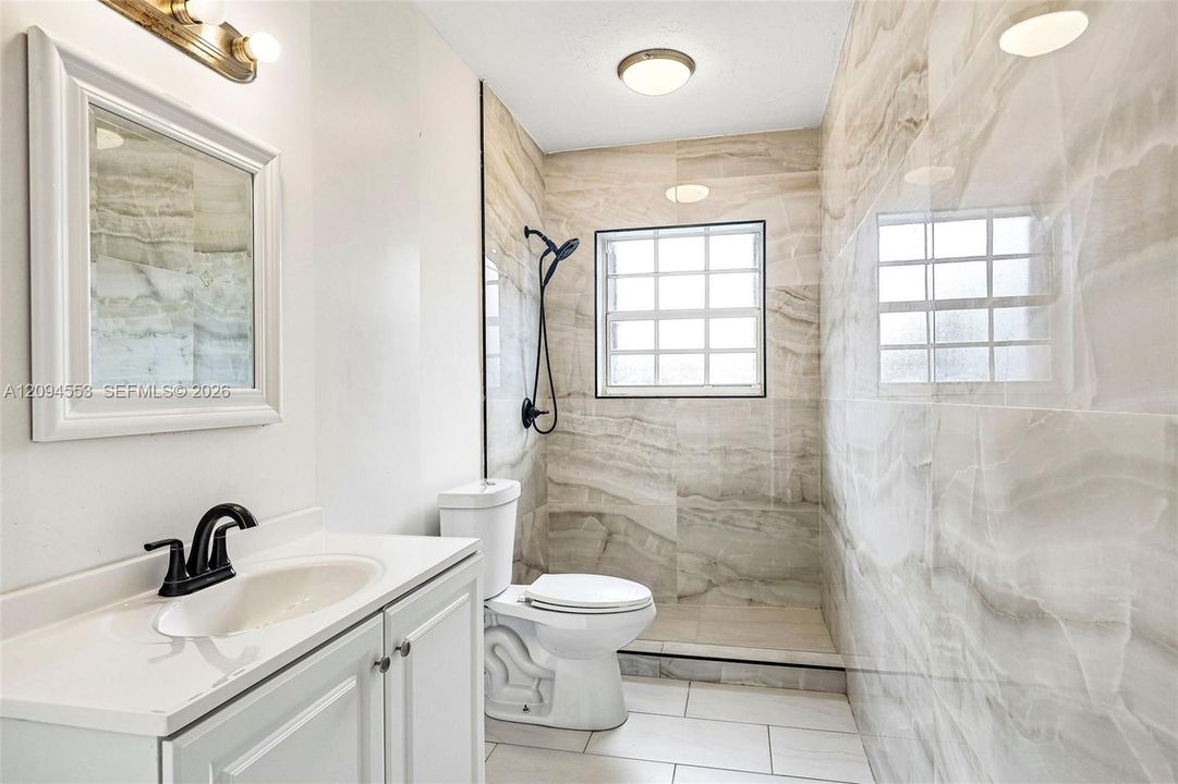 Renovated bathroom with walk-in shower