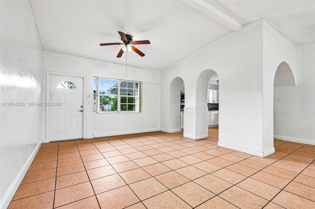 Living room at the front entry, vaulted ceiling