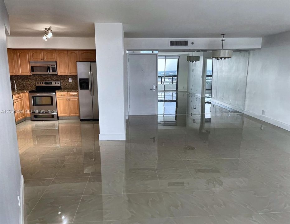 Living Room + Partial View of the Kitchen