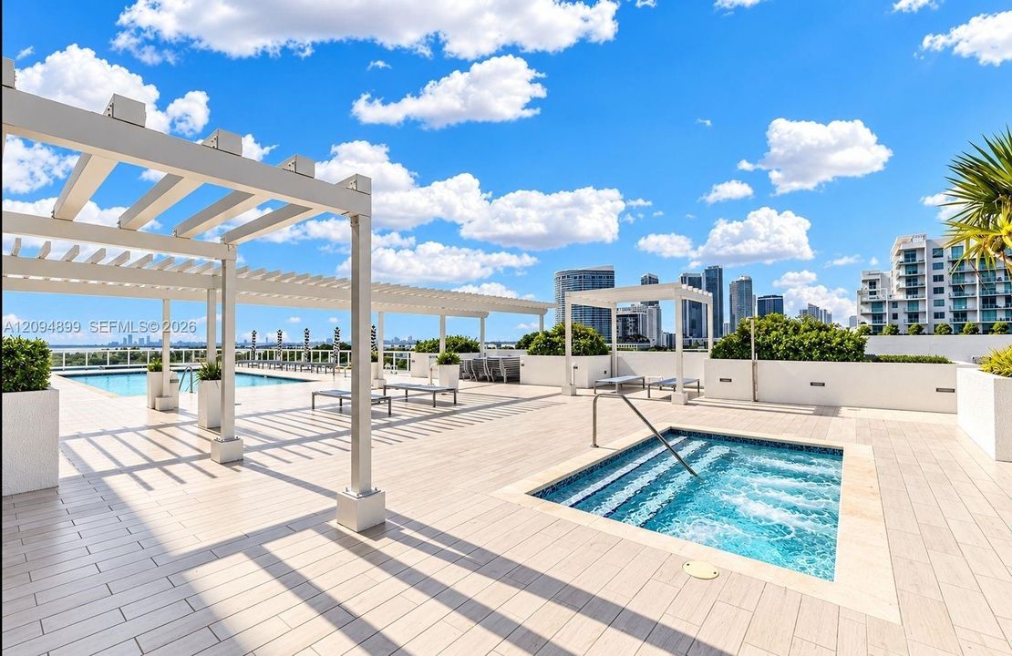 Rooftop terrace featuring tile flooring, an in-ground spa, a swimming pool, and pergola structures