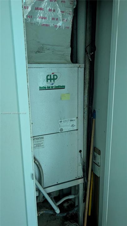 Utility closet containing an air handling unit with insulated ductwork