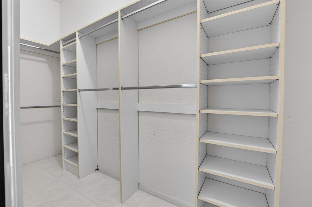 ONE OF TWO CUSTOM FITTED CLOSETS