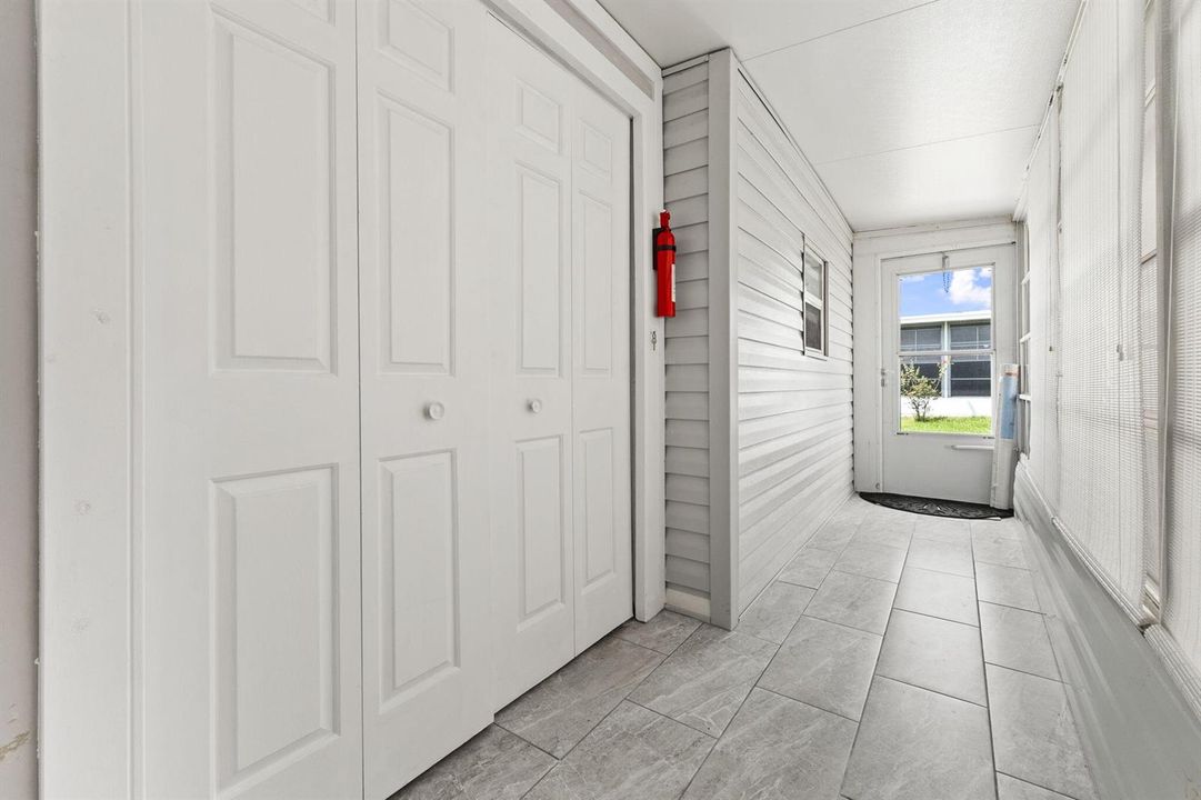 HALLWAY WITH STORAGE - REAR DOOR