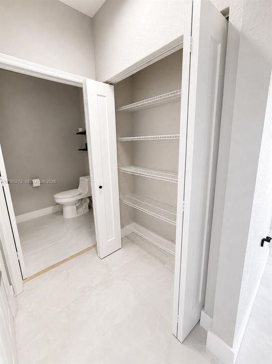 Downstairs, hallway storage closet