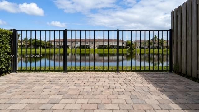 Backyard fenced patio with lake view
