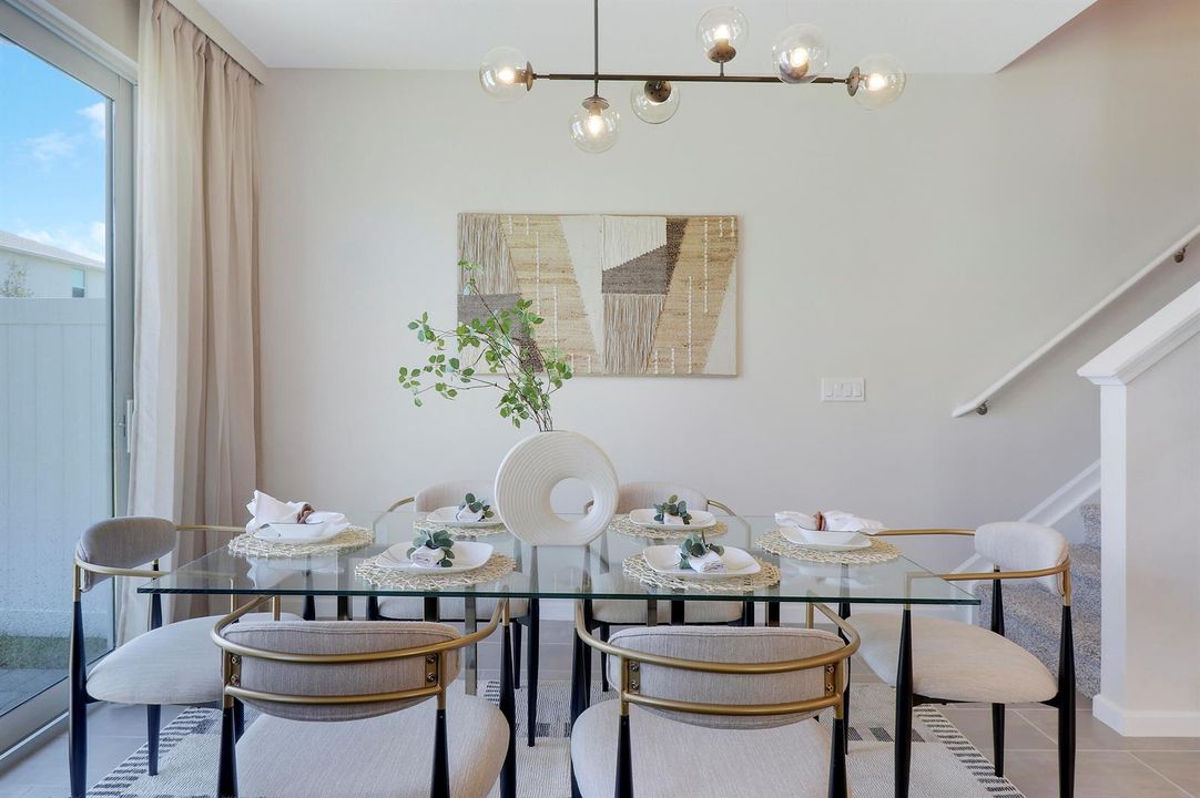 Dining area with modern fixture