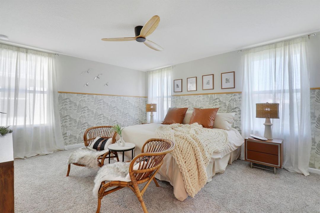 Wallpapered bedroom with fan