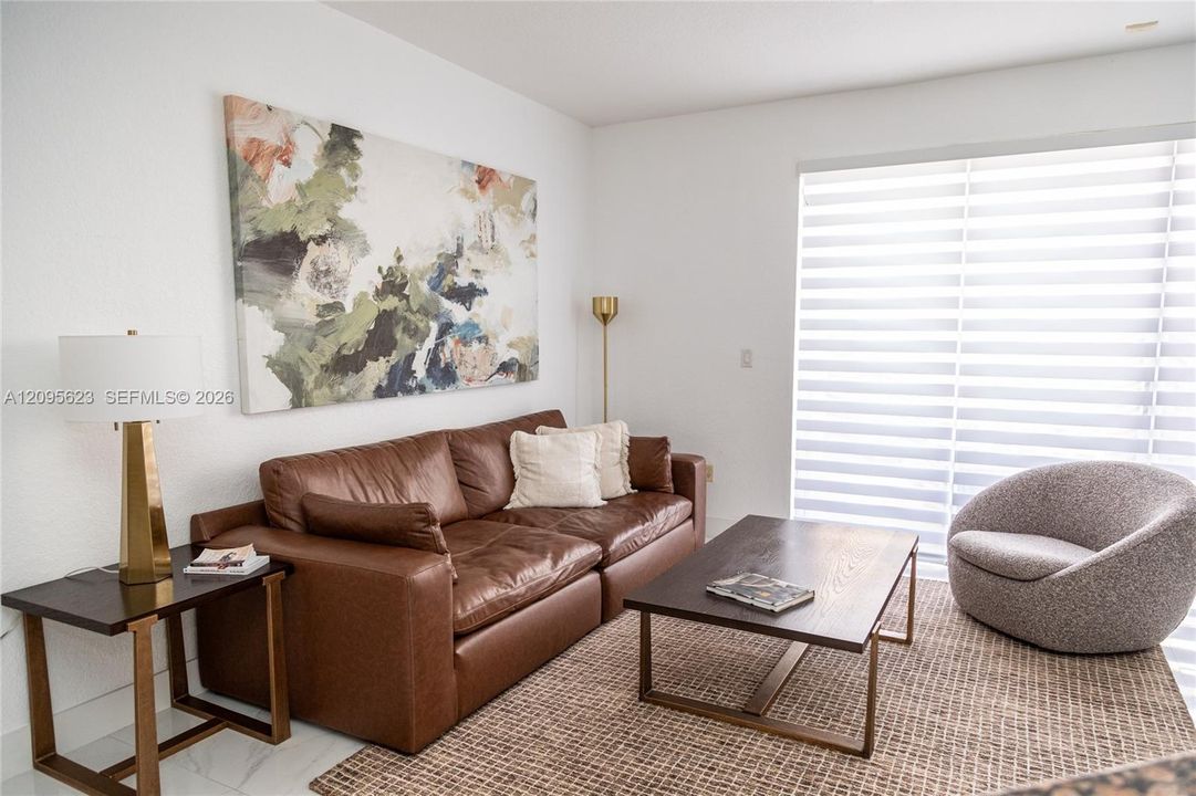 Spacious living room filled with natural  light