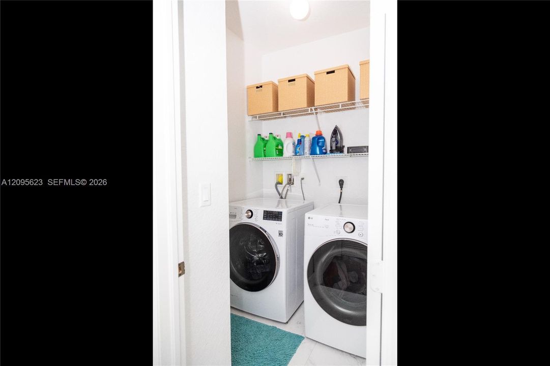 Convenient upstairs laundry room.