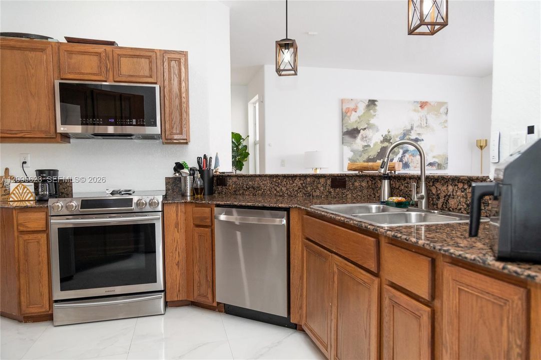 Spacious counter space and  an open layout ideal for cooking and entertaining .