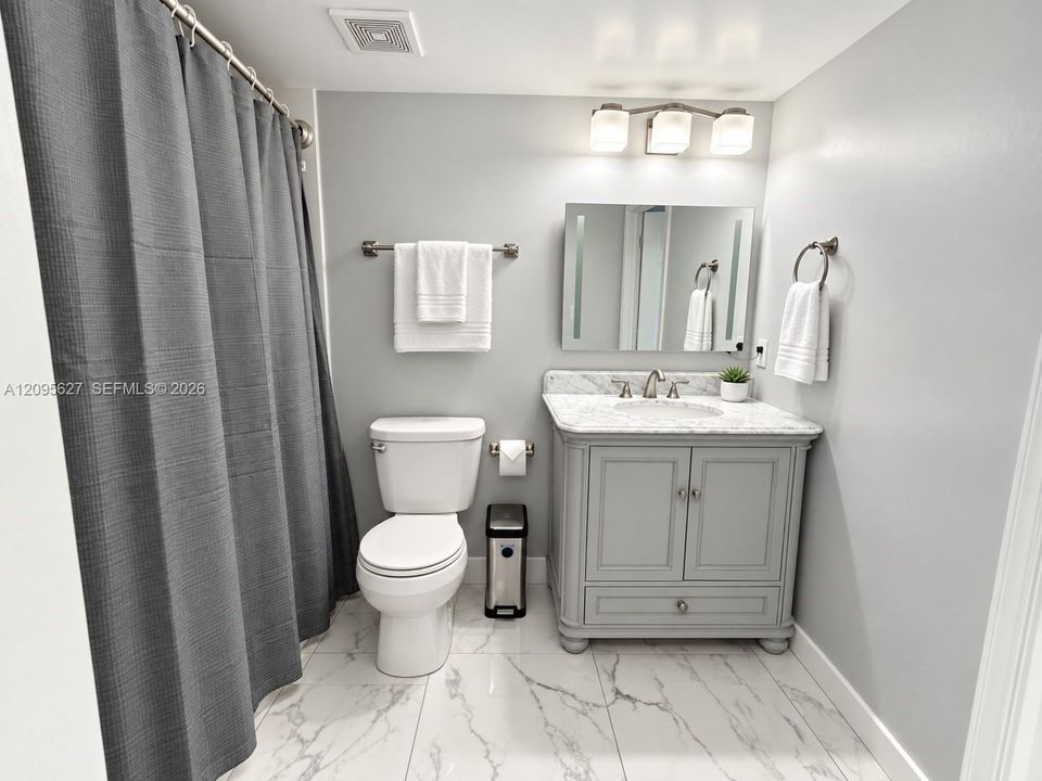Full bathroom with modern grey vanity