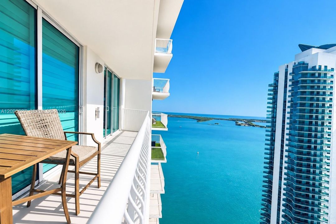 Balcony with seating and sweeping bay views